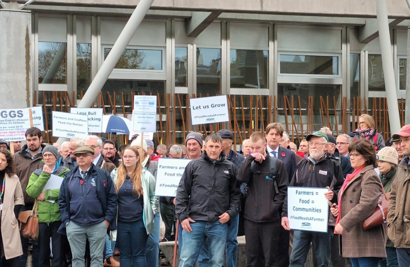 Alex standing amidst other rally participants.