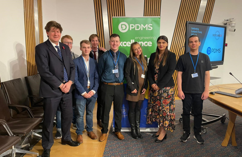 Alex and Pam Gosal MSP stand and pose with current and past recipients of the prestigious Young Software Engineer of the Year Awards.