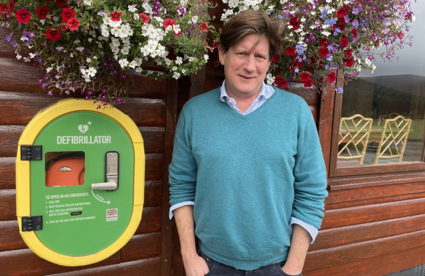 MSP Alexander with a defibrillator