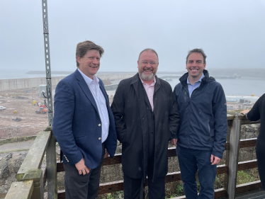 Alex is pictured with Maurice Golden and David Duguid at the harbour.