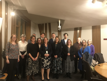 Alex stands with members of the Neurological Alliance of Scotland, MEAction Scotland, Cerebral Palsy Scotland, Epilepsy Scotland, Alzheimer Scotland, Parkinson's UK in Scotland, Headway Dundee & Angus, and Headway East Lothian.